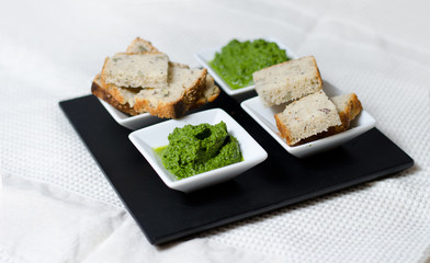Green sauce and bread slices