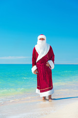 Santa Claus relaxing at sea beach - Christmas concept