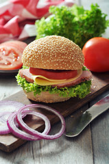 Sandwich with ham, cheese,  tomato and lettuce