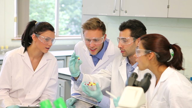 Team of science students working in the lab