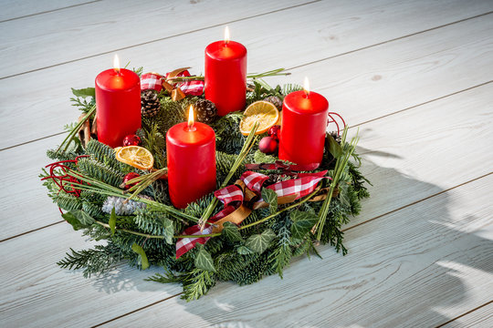 Advent wreath with burning red candles