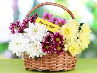 Fototapeta na wymiar Bouquet of beautiful chrysanthemums in wicker basket