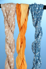 Colored scarves on blue background