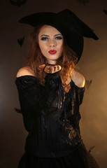 Fototapeta na wymiar Halloween witch on dark background