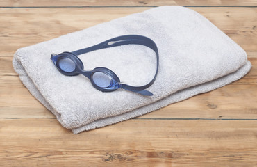 Swim goggles on towel