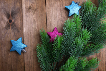 Christmas fir tree  and decorations on wooden background