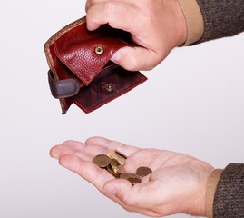 Broke businessman with empty wallet and polish coins