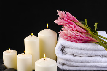 Fototapeta na wymiar Spa feeling with Ginger flower with ,towel ,white candle
