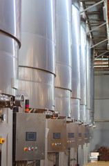Wine manufacturing. Modern winery tanks.