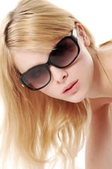 portrait of a young beautiful woman in sunglasses