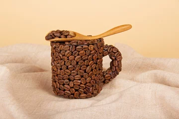 Gordijnen Coffee grains in spoon and cup © laboko