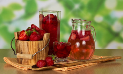 Jug with drink from strawberry