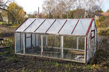 greenhouse construction in autumn garden