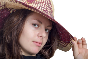 Portrait of a beautiful woman in a straw hat