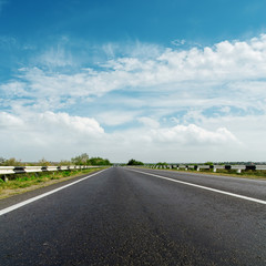 black asphalt road and cloudy horizon