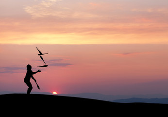 silhouette of juggler in sunset