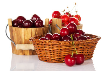 Buckets with red sweet cherry