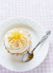 Tarts with whipped cream on the plate