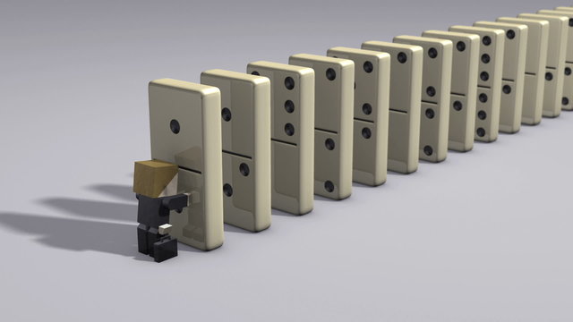 business man starting domino effect