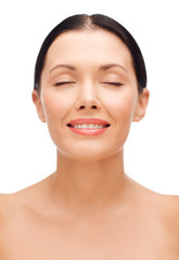 Obraz premium smiling young woman with closed eyes
