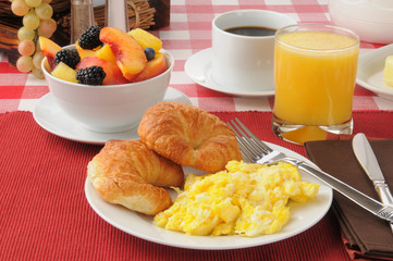 Scrambled eggs and croissants