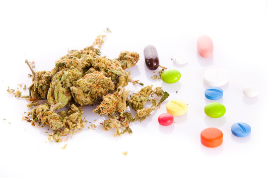 marihuana and pills isolated on white background