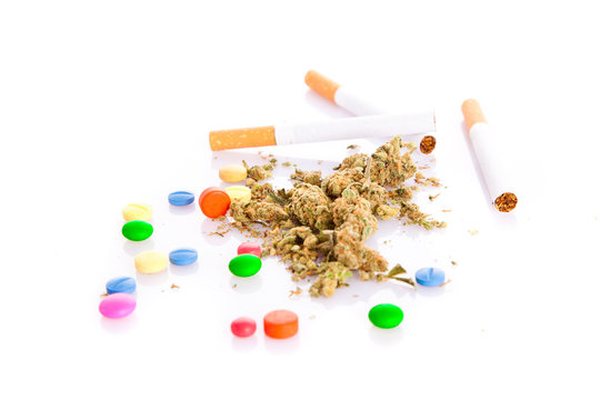 marihuana and pills on white background, smoker