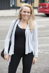 A young gorgeous female blond teen posing on a cloudy day in Chicago.