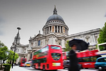 Fotobehang St Paul's Cathedral in London, the UK. Red buses in motion © Photocreo Bednarek