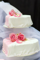 Wedding cake in white and pink.