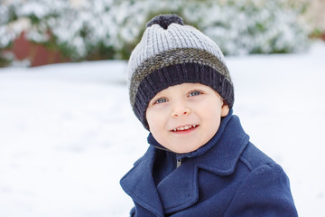 Adorable toddler boy on beautiful winter day