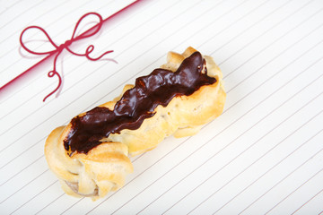 Fresh eclairs with coffee cream inside and chocolate