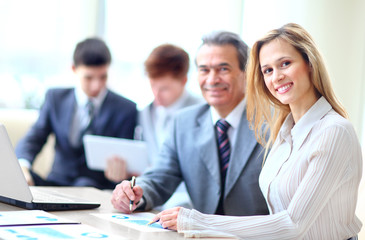 business people with paper work in board room