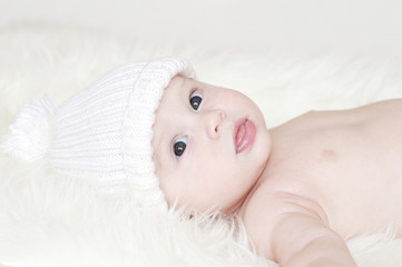 beautiful baby in white hat