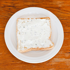sandwich from toast and soft cheese with herbs