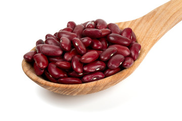dried red beans in a spoon isolated on white background