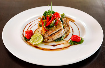 Fillet sea bass meuniere with vegetable and potatoes.