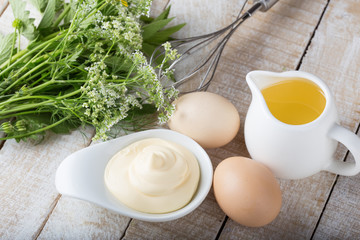 Mayonnaise in bowl on table