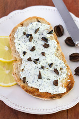 toast with cheese, olives and lemon