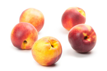 Ripe peaches fruits isolated on white