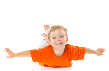 Happy boy sitting on the floor