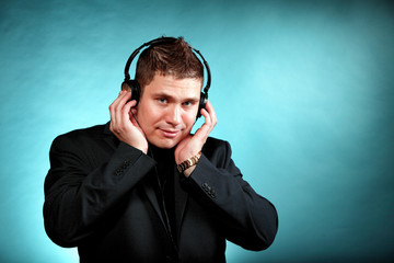 young man with headphones listening to music