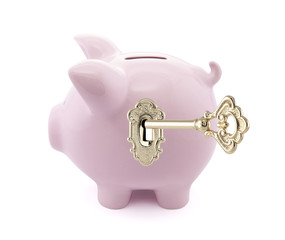 Piggy bank with golden key