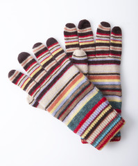 Colourful winter gloves on white background