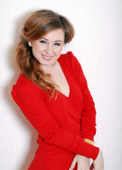 Young Smiling Beautiful Woman in a red dress