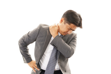 肩痛を訴えるビジネスマン