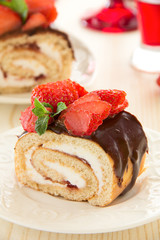Chocolate swiss roll cake with strawberries