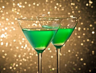 glasses of green cocktail on table