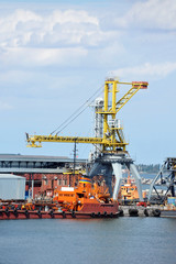 Bunker ship (fuel replenishment tanker) under port crane