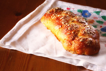 challah bread on wooden table